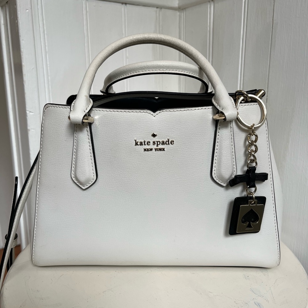 Kate Spade white leather satchel and crossbody strap.